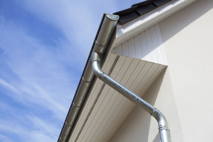 Rain gutter or Eavestrough with downspout maked of steel galvanized.